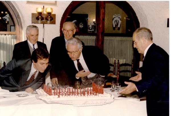 25th anniversary. Messrs. Palau and Mr. Soler blowing candles on anniversary pie. 25th anniversary S&P (Spain), 1976